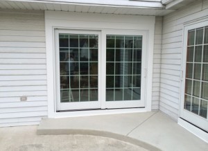 Exterior of home with newly installed sliding doors