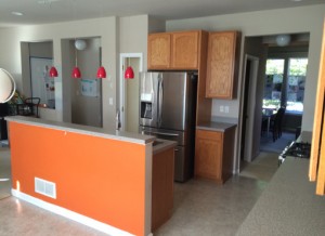 Home with outdated oak cabinets and orange island