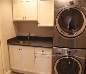 kitchen renovation with stacked laundry machines