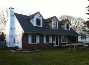Home under construction with new second story windows installed