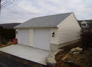 Garage with roofing and siding to match home