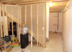 wooden frames and unpainted walls of basement