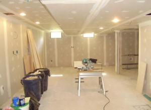 Interior of basement during renovation with materials and bare walls